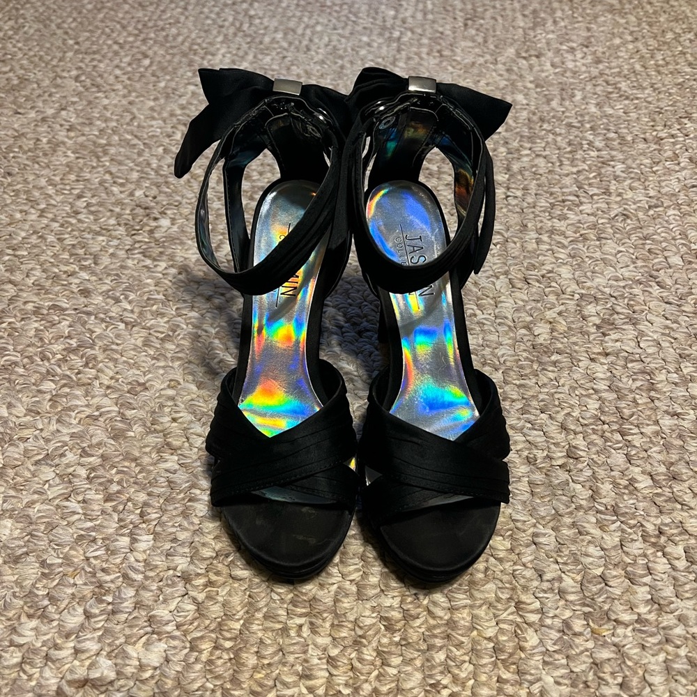 Jasmin Collection peep toe black pump with adorable bow on back. Size 7 1/2